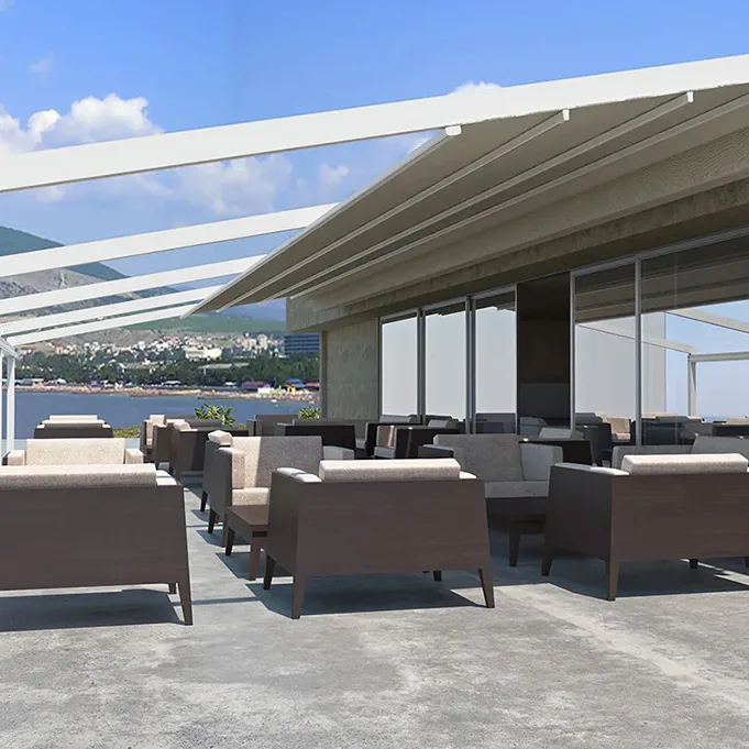 ptixsomeni pergola exoterikou xorou metaform Πτυσσόμενη τεντοπέργκολα MetaForm σε εστιατόριο με θέα τη θάλασσα και καρέκλες εξωτερικού χώρου